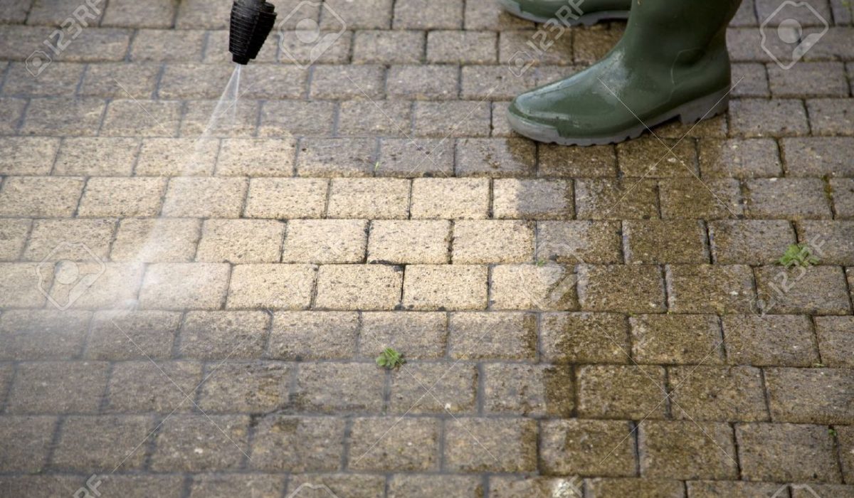 20831082-Outdoor-floor-cleaning-with-high-pressure-water-jet-Stock-Photo